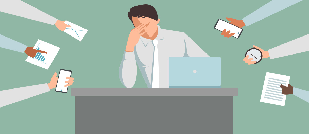 Image of a busy employee with several people demanding his attention for their tasks illustrating the need for Smarter Course Design for Busy Employees